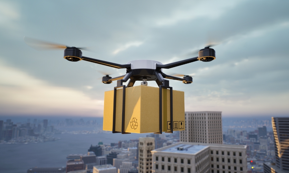 Drone carrying a box high in the sky